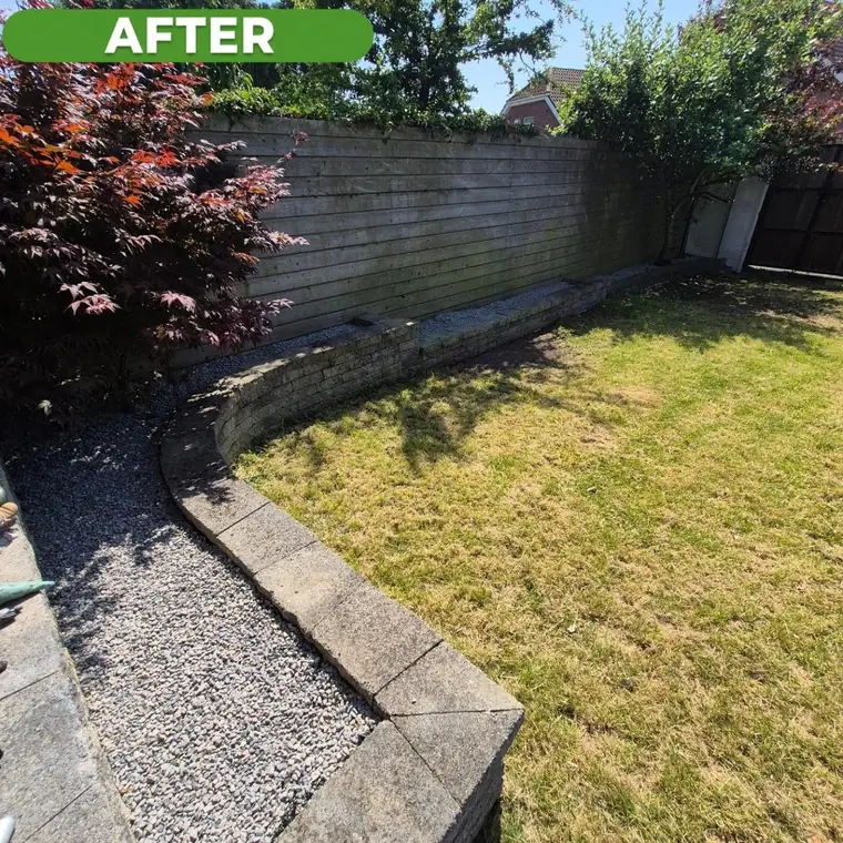 The same back lawn after work, cut and reshaped.
