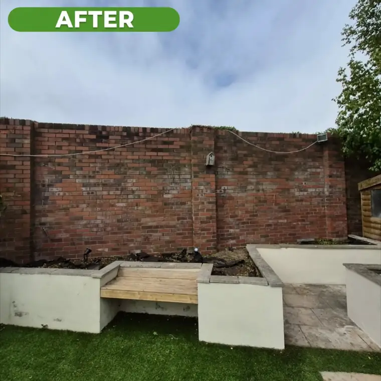 The same walled yard after work, cleared and swept.