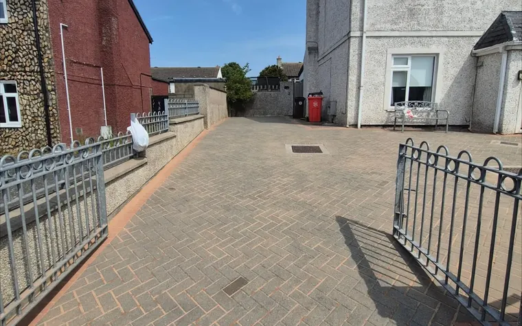 Cobblelock driveway with the joints cleared of weeds and moss.